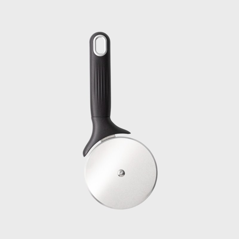 Black-handled pizza wheel cutter with a large stainless steel circular blade on a light gray background