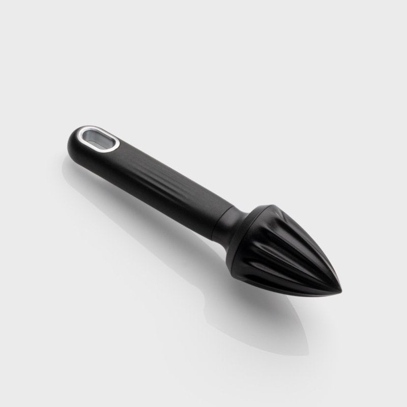 Black citrus reamer with a textured handle and pointed ridged juicing head on a white background.