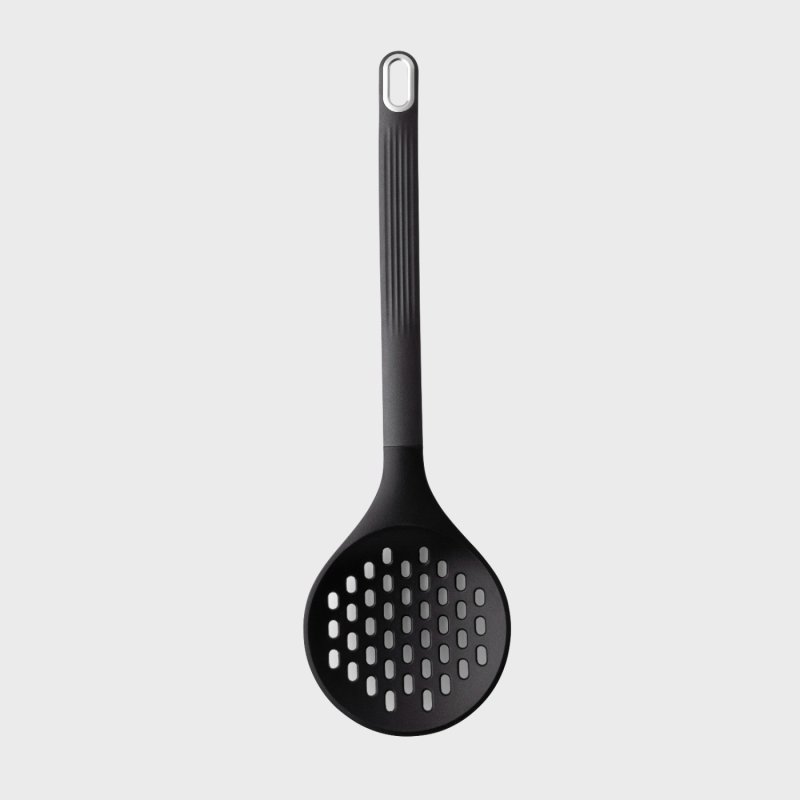 Black silicone skimmer with long handle and oval drainage holes, shown against a light background.