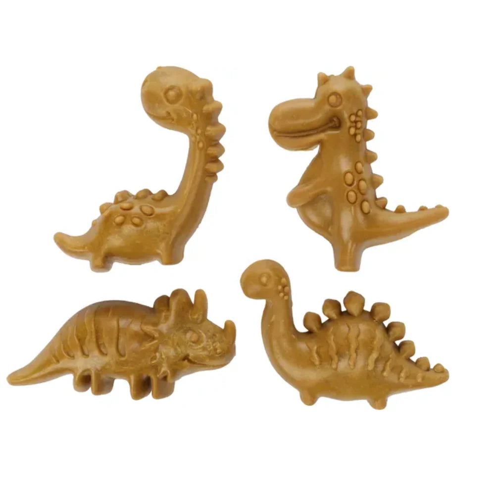 Four pineapple-flavored dinosaur-shaped dental sticks for dogs on a white background.