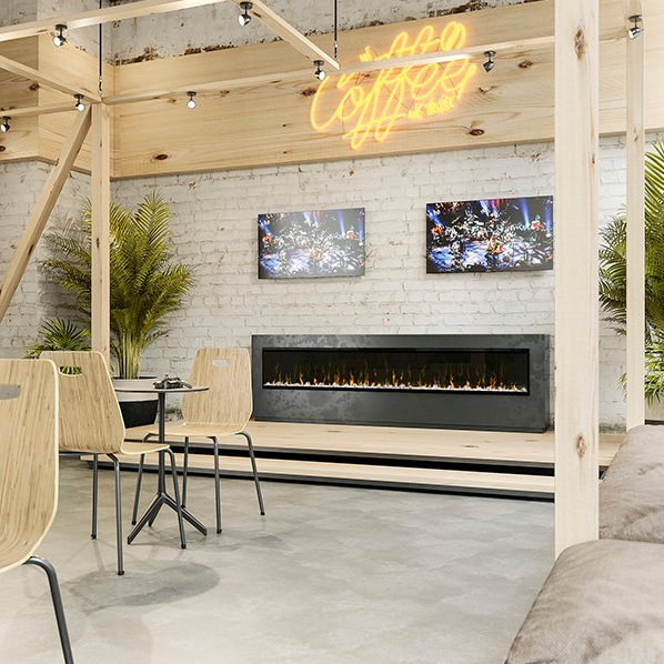Dimplex 100" Ignite Frameless Optiflame electric fireplace installed in a modern cafe setting with wooden chairs and neon