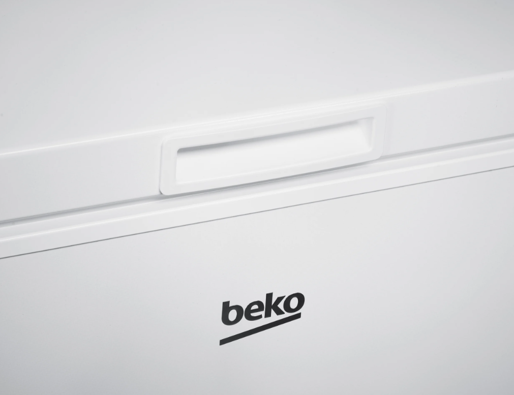 Close-up of the white Beko Chest Freezer CF4198W handle and logo on the front panel.