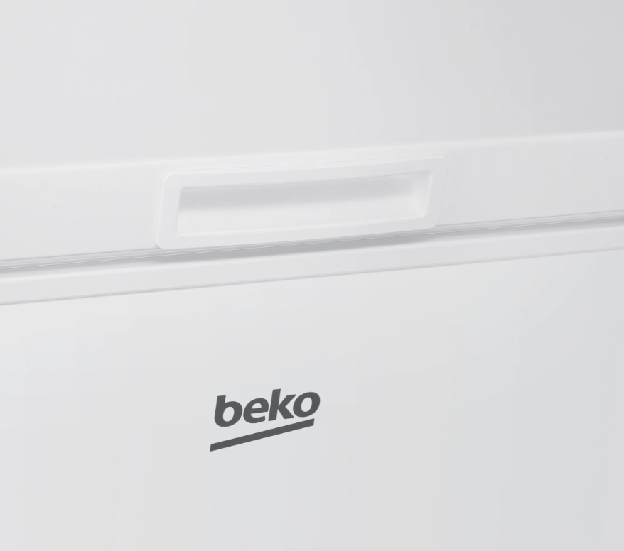 Close-up of the white Beko chest freezer lid handle and logo on the front panel.