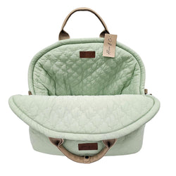 Lottie Travel Bag in pastel sage green with quilted design, leather straps, soft cushion, and safety clip by Keans