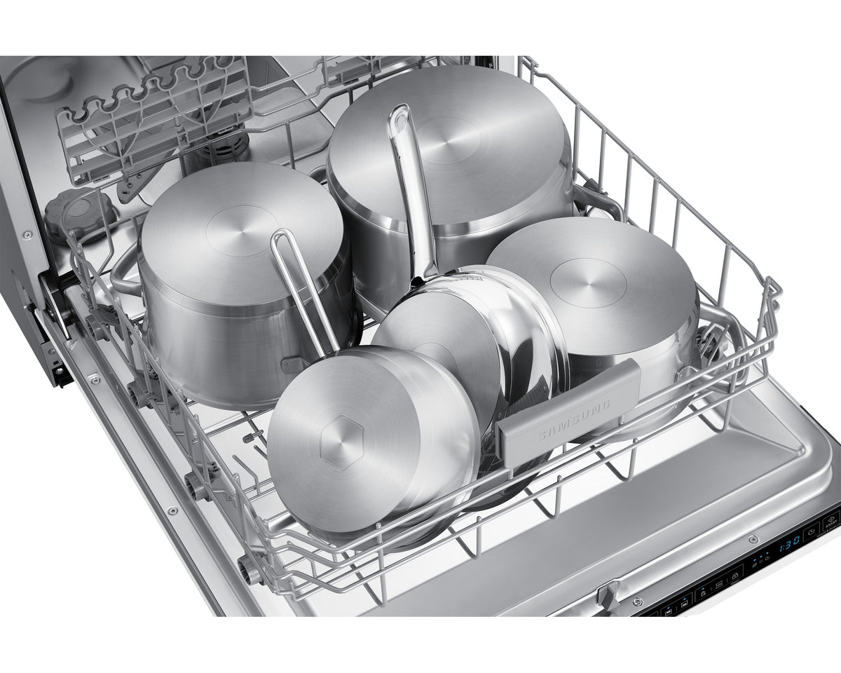 Open Samsung dishwasher loaded with stainless steel pots and pans in the lower rack.