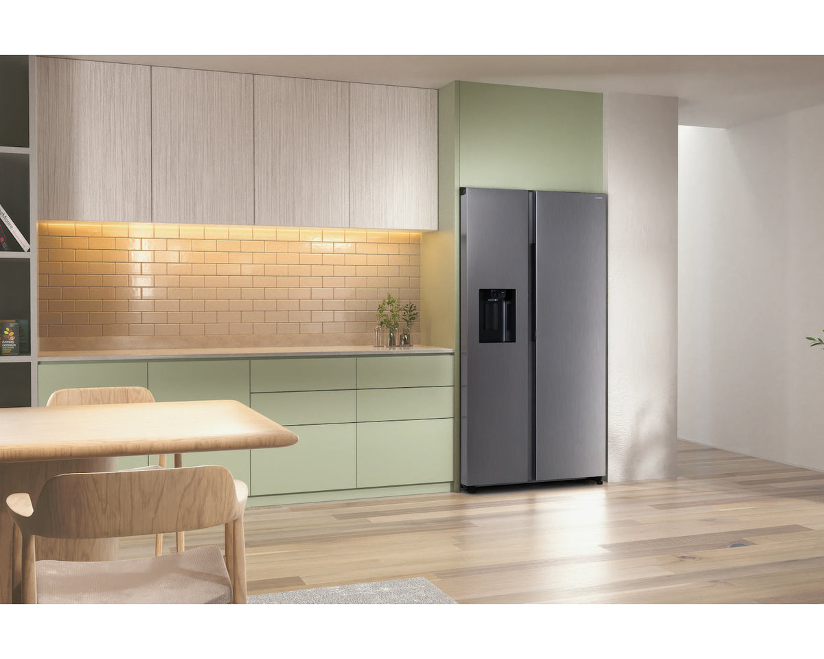Samsung American Fridge Freezer in stainless steel with side-by-side doors and water dispenser in a modern kitchen.