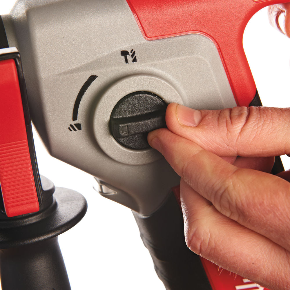 Close-up of a hand adjusting the mode selector on a Milwaukee M18 Compact SDS+ Hammer Drill.