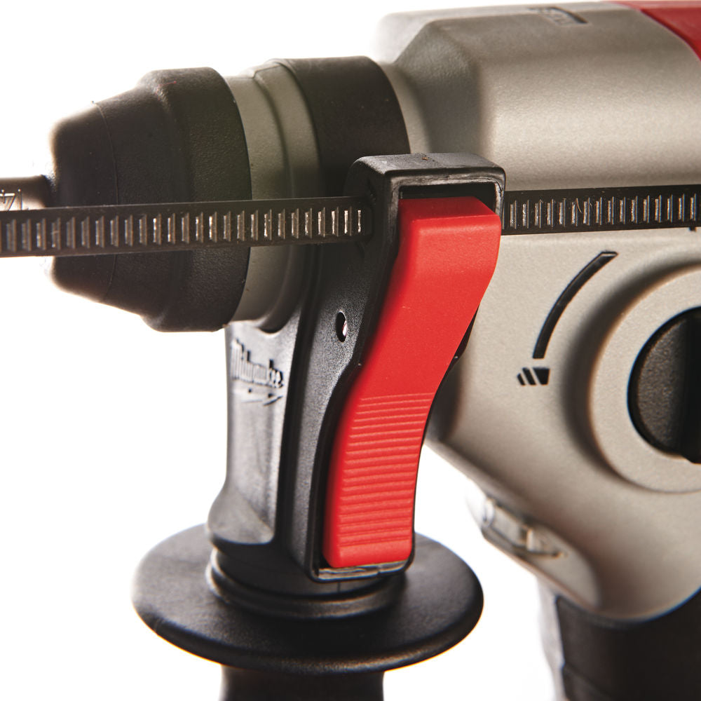 Close-up of the red trigger and front handle of the Milwaukee M18 Compact SDS+ Hammer Drill.