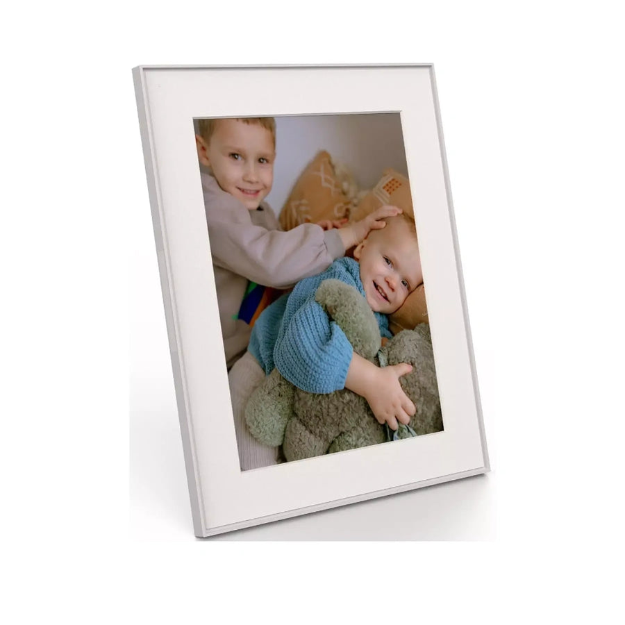 Aura Walden 15 Inch Digital Photo Picture Frame in clay with white paper mat showing a photo of two children.