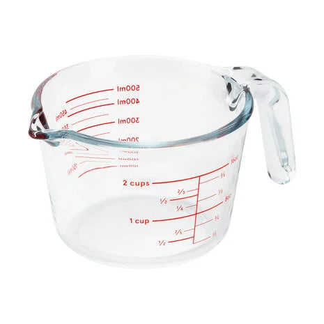 Judge Kitchen 500ml glass measuring jug with red measurement markings and a clear handle, angled view.