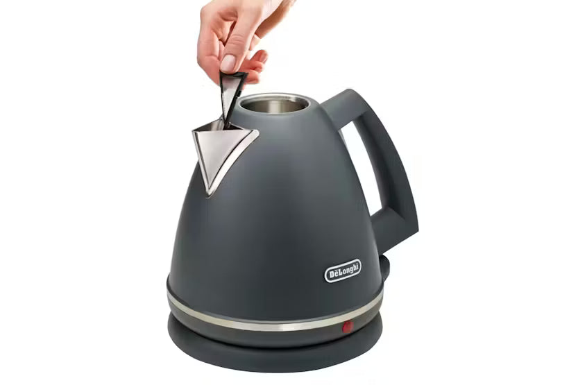 Delonghi Argento Silva Grey kettle with lid open and hand lifting the lid tab, shown on its base.