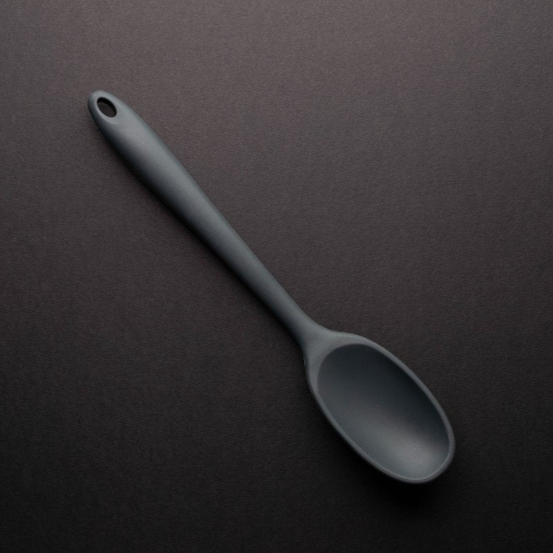 Graphite-colored 28cm silicone spoon with a hole at the handle end on a dark background.