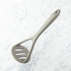 Silicone Masher Grey for easy mashing, durable and heat-resistant – available at Keans Claremorris.