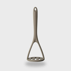 Grey silicone masher with steel core, heat-resistant, BPA-free, dishwasher safe, soft grip – available at Keans Claremorris.