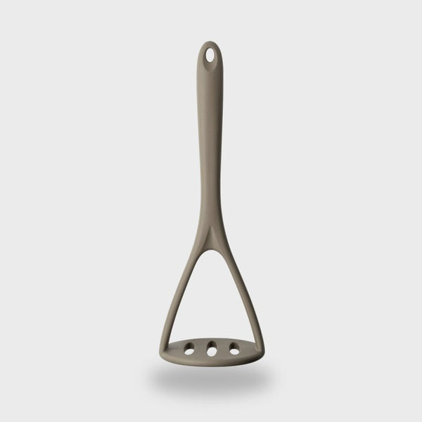 Grey silicone masher with steel core, heat-resistant, BPA-free, dishwasher safe, soft grip – available at Keans Claremorris.