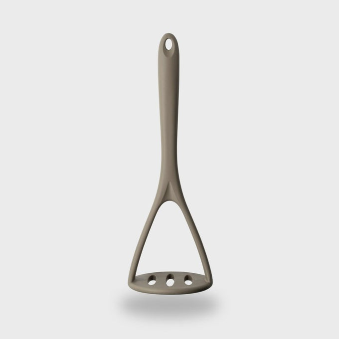 Grey silicone masher with steel core, heat-resistant, BPA-free, dishwasher safe, soft grip – available at Keans Claremorris.