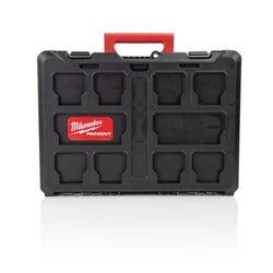 Milwaukee Packout tool case in black with a red handle and a red Milwaukee Packout logo badge on the front, shown on a white background with a soft reflection.