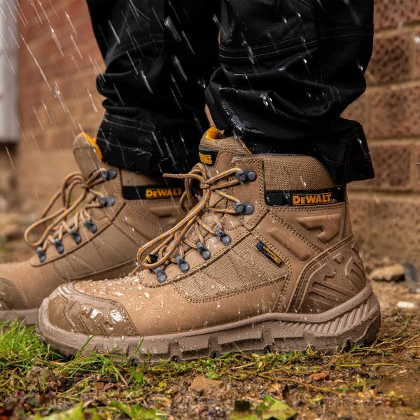 DeWalt Milburn Stone Waterproof Boots worn in rain, showing water resistance and rugged sole on wet ground.