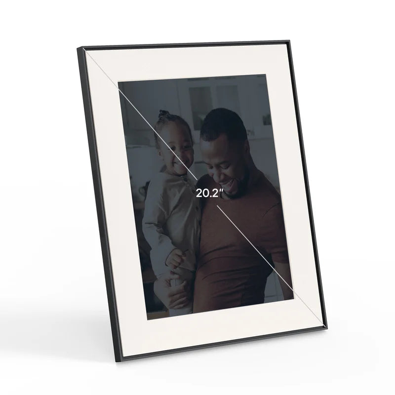 Aura Walden 15'' digital photo frame in matt black with white matting, displaying a family photo.