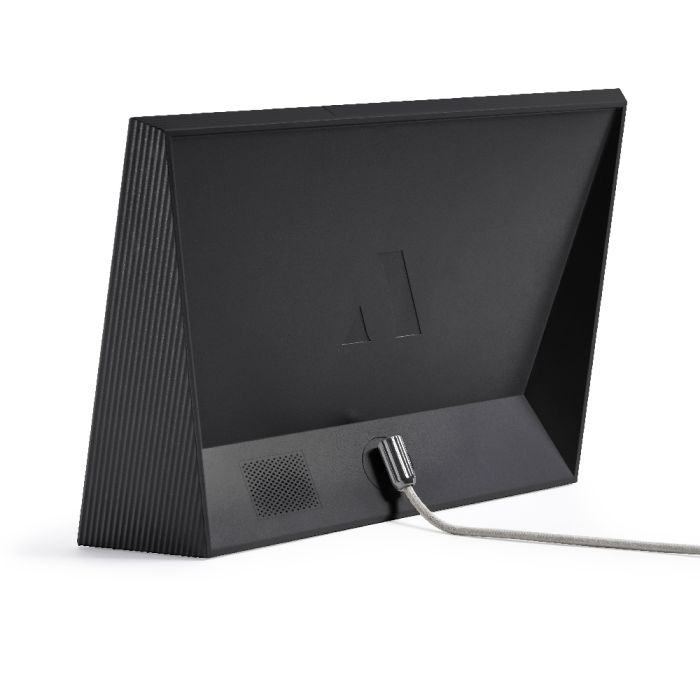 Back view of Aura Carver 10.1 Inch WiFi Digital Photo Frame in black with power cable connected.