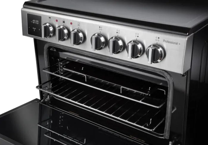Rangemaster PROPL60ECSS/C 60cm stainless steel ceramic cooker with open oven door and control knobs visible