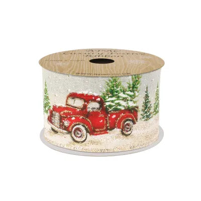 Cream wired-edge ribbon spool with red pickup truck carrying presents and green pine trees on a cream background.