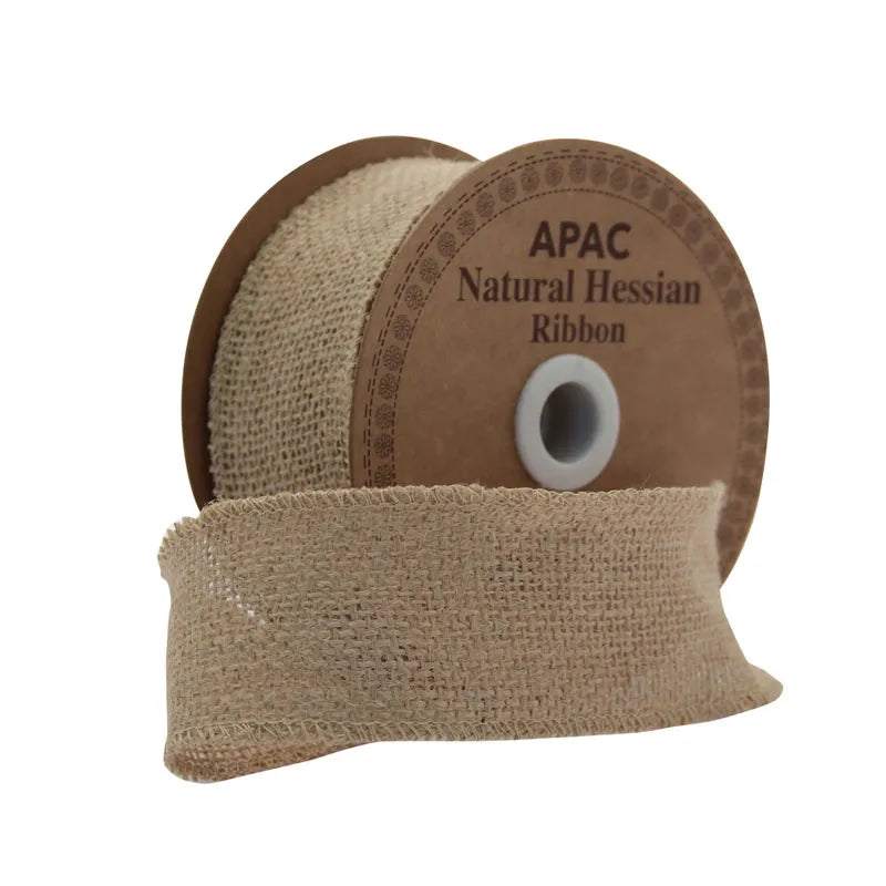 Roll of natural hessian ribbon with textured jute weave on a brown spool labeled APAC Natural Hessian Ribbon