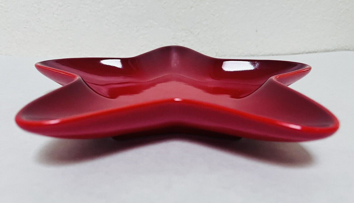 Le Creuset 20cm Star Plate in Cerise red, durable stoneware, perfect for stylish dining – available at Keans Claremorris.