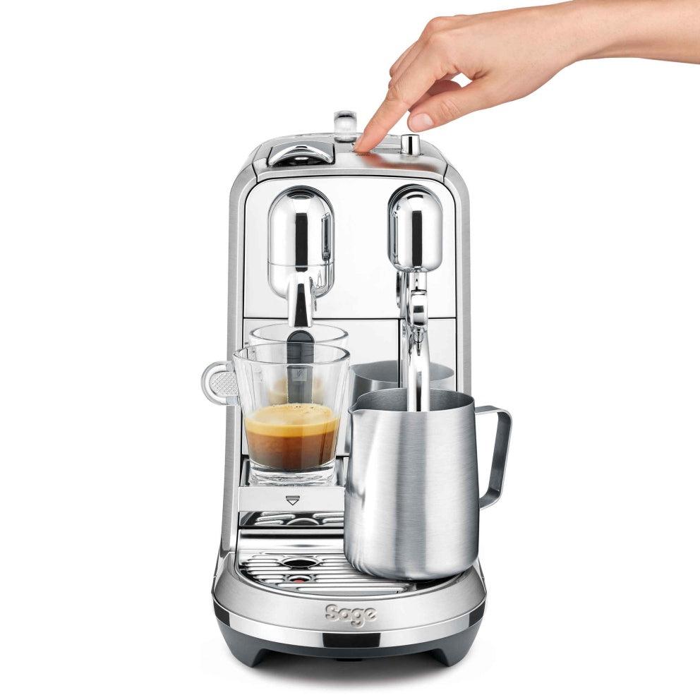Sage The Creatista Plus Nespresso machine in brushed stainless steel with espresso and milk frothing jug, hand pressing