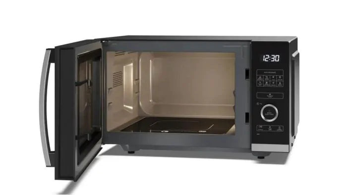 Sharp 25L 900W silver flatbed microwave with open door showing interior and digital control panel at 12:30