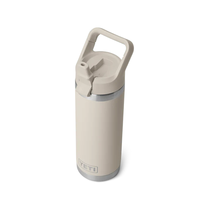 Yeti Rambler 18 oz bottle in Cape Taupe with a flip straw lid and carry handle, shown upright.