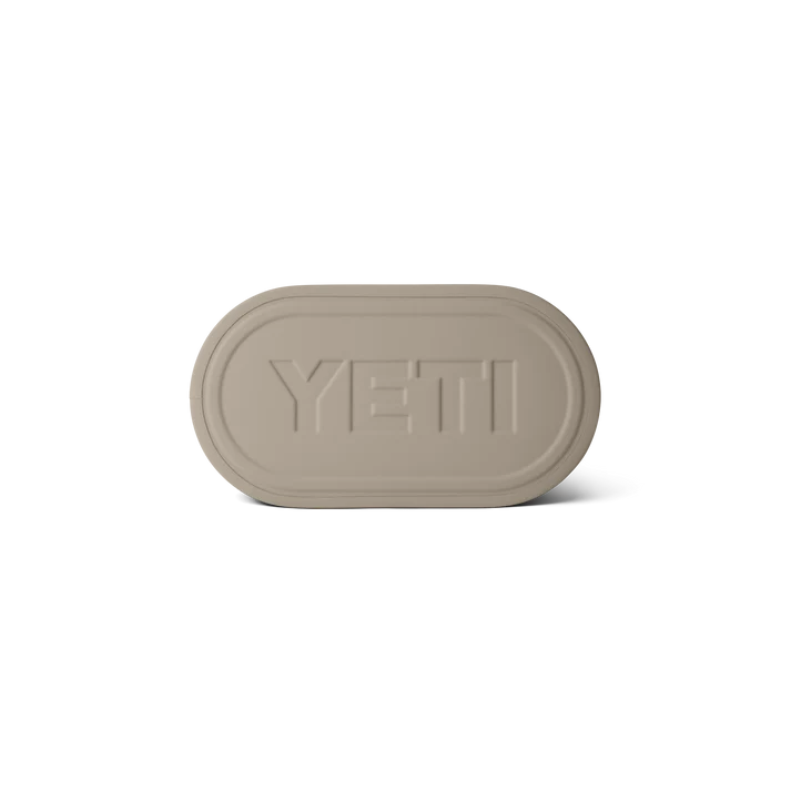 Bottom view of YETI Camino Carryall 35 2.0 tote bag in Cape Taupe showing embossed YETI logo.