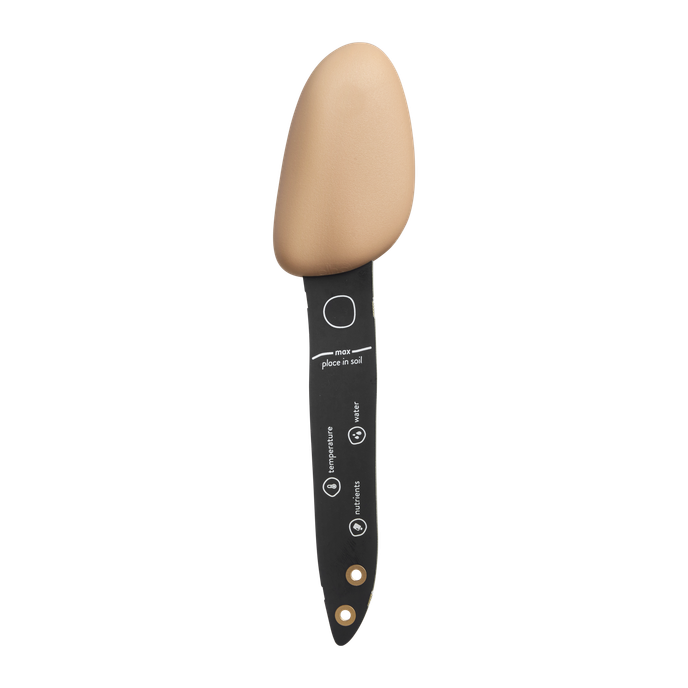 Smart Pebble plant care sensor with beige pebble top and black stake showing water, temperature, and nutrients icons.