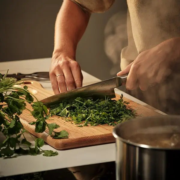 Stellar Poise 21cm Cooks Knife with sharp stainless steel blade, ergonomic handle – available at Keans Claremorris.