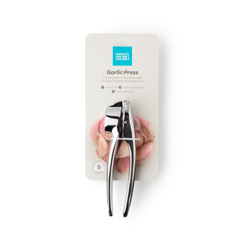Chrome zinc-aluminium garlic press on white card packaging with garlic cloves background.