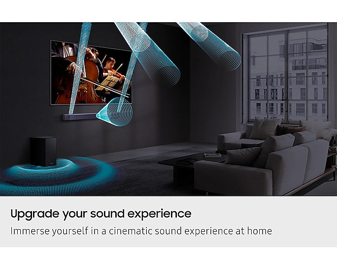 Samsung Q600F soundbar and subwoofer in a living room with visualized Dolby Atmos sound waves.