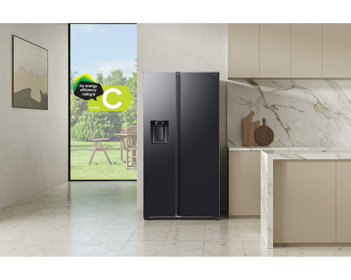 Samsung Plumbed Series 8 black American fridge freezer with water dispenser in a modern kitchen setting