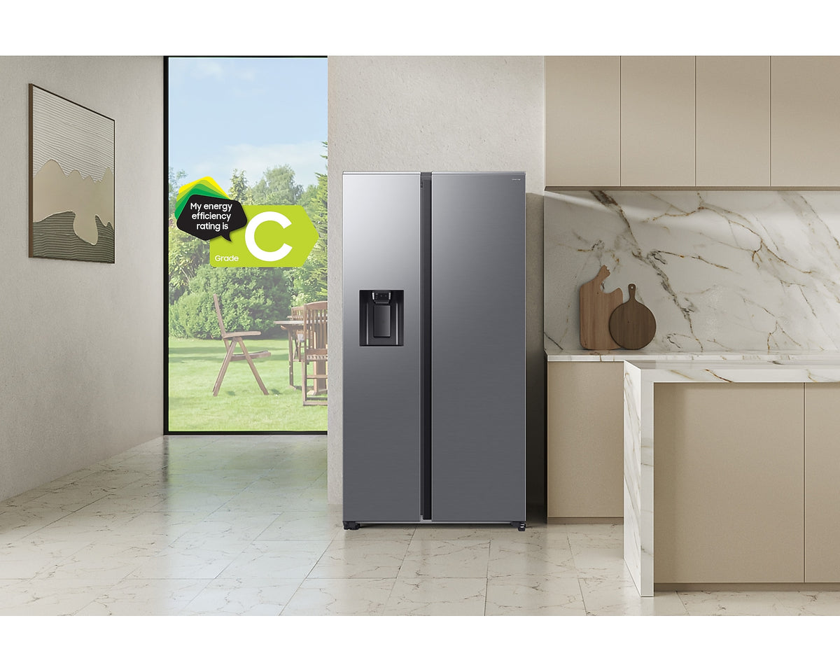 Samsung Series 8 silver American fridge freezer with water dispenser in a modern kitchen setting