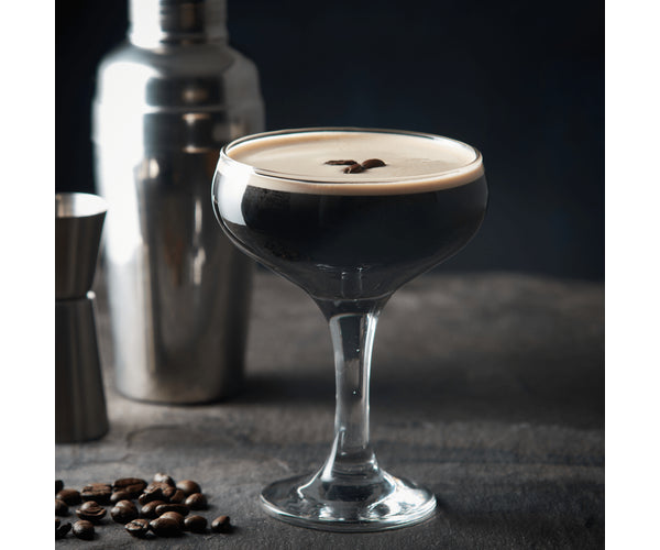 Set of two 20cl cocktail saucer glasses, one filled with a dark coffee cocktail topped with coffee beans.