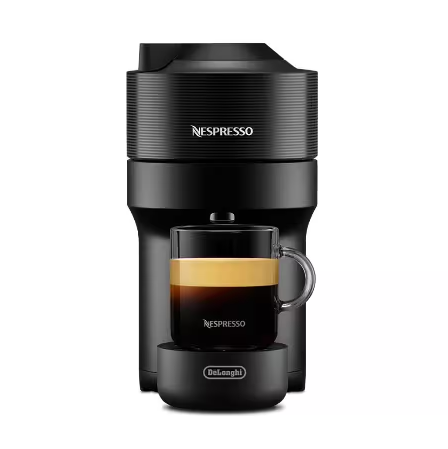 Delonghi Nespresso Vertuo Pop coffee machine in black with a glass cup of espresso on the drip tray