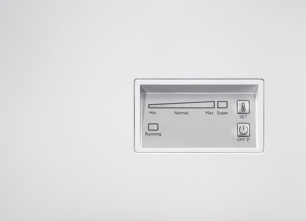 Control panel with temperature settings and power buttons on the Beko Chest Freezer CF4198W white surface