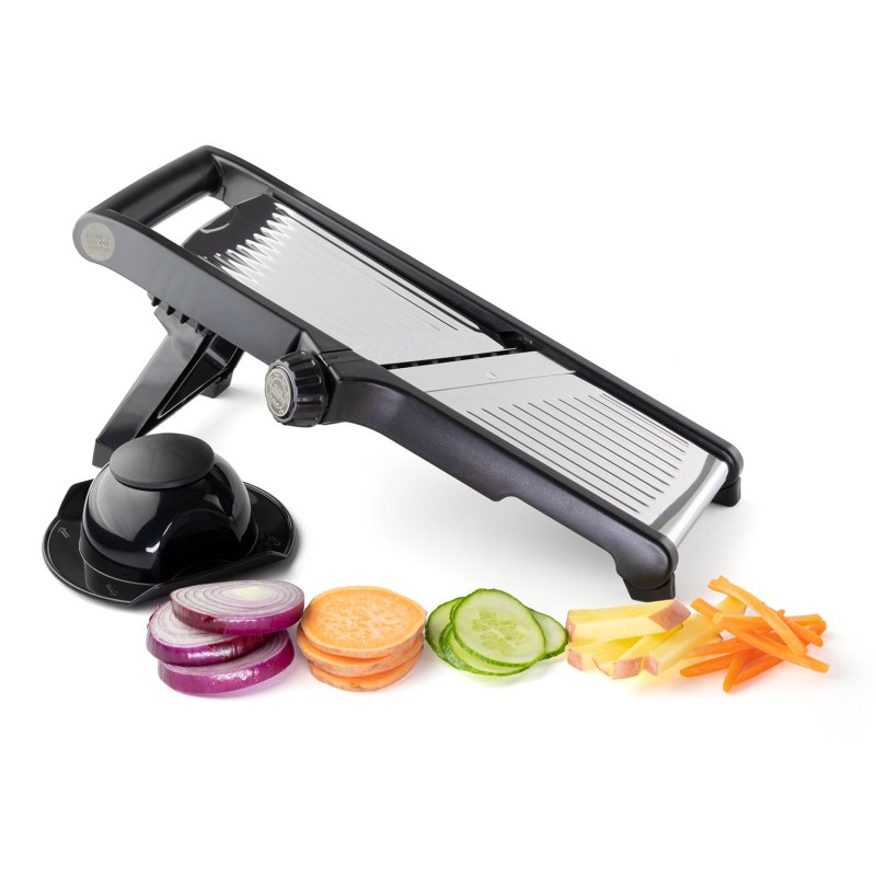 Professional adjustable mandoline slicer with hand guard and sliced onion, sweet potato, cucumber, potato, and carrot pieces.