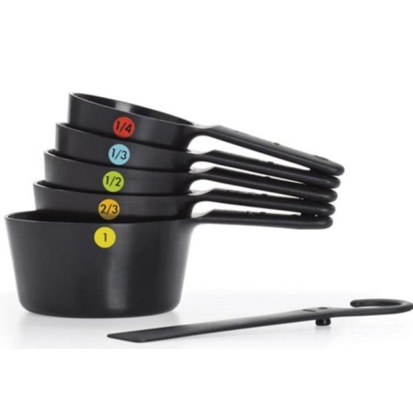 Oxo 6-piece plastic measuring cups set with non-slip grips, color-coded markings, and scraper, available at Keans