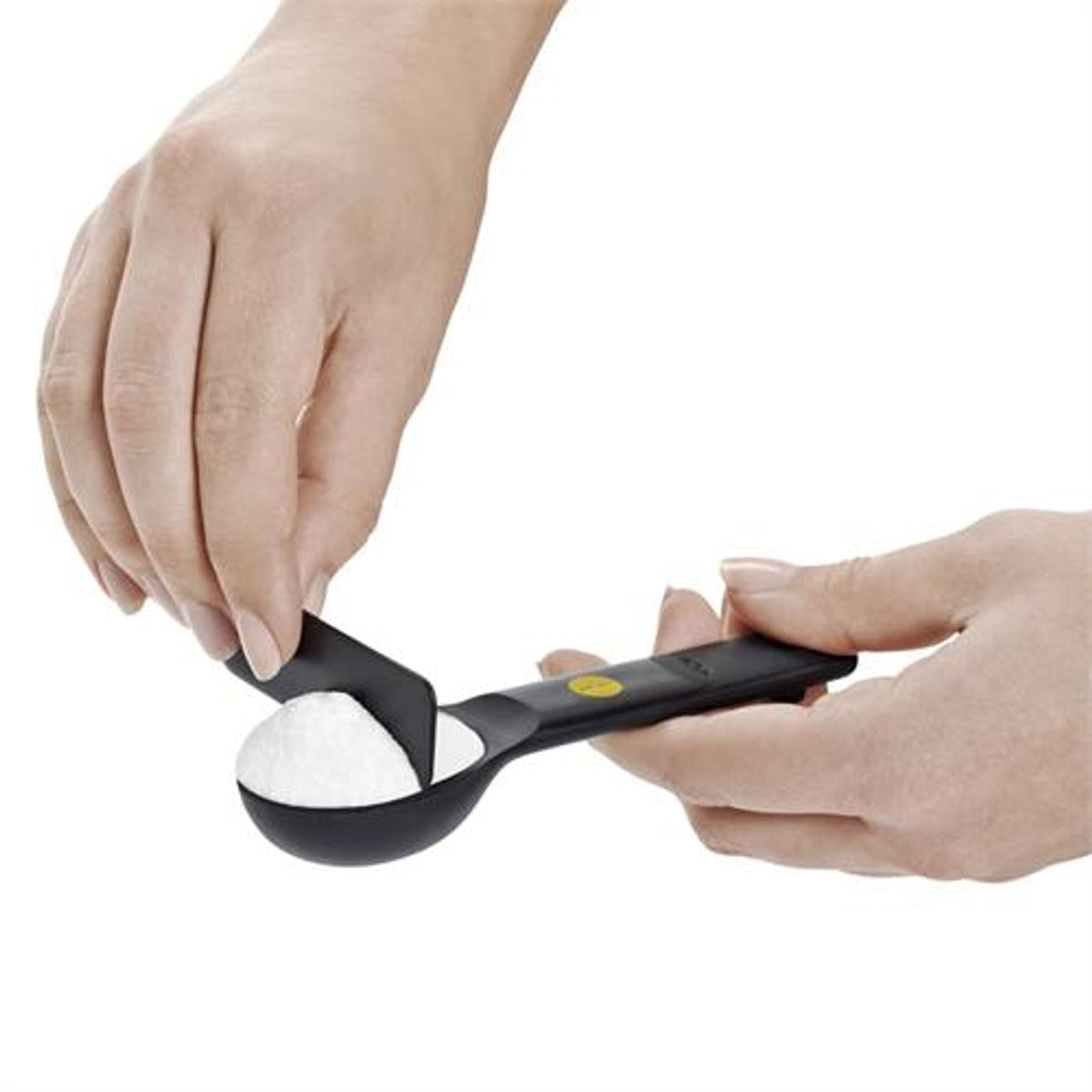 Oxo 7-piece black plastic measuring spoon set with snap ring, available at Keans Claremorris.