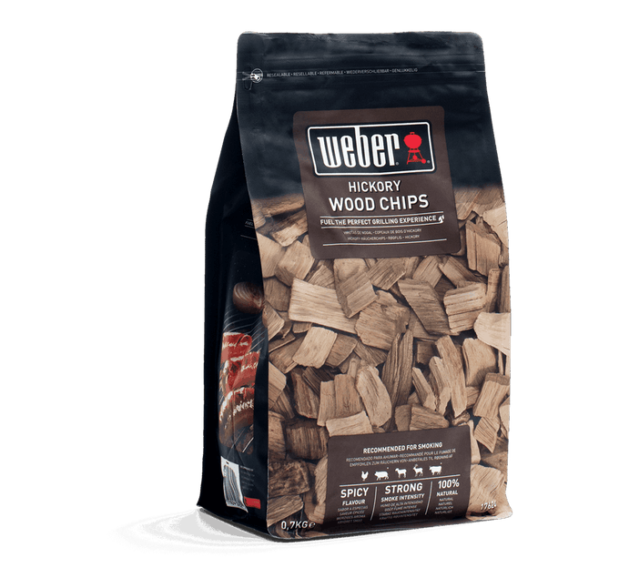 Weber Hickory Wood Chips 0.7kg for bold smoky BBQ flavor, perfect for beef, pork, chicken. Available at Kean’s Claremorris.