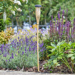 Flaming Bamboo Tiki Torch with natural bamboo design, perfect for outdoor ambiance – available at Keans Claremorris.