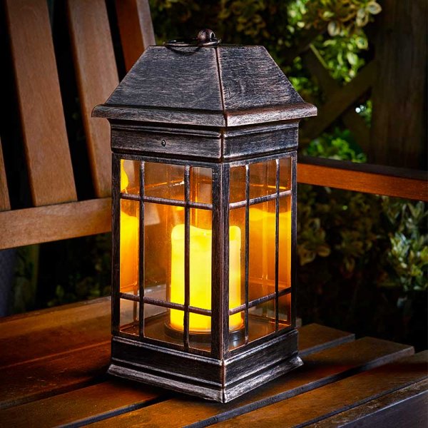 Seville Lantern by Keans Claremorris, elegant Spanish-style solar lantern, charges in sunlight, auto-illuminates at night.